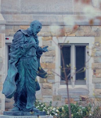 St. Ignatius Statue with flowers
