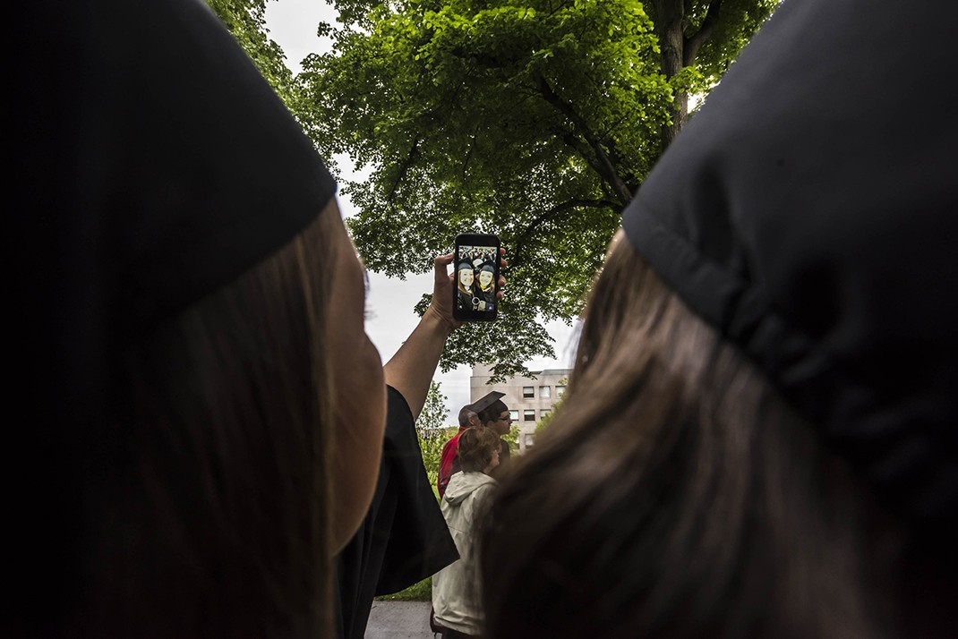 The graduating class gathered on Linden Lane before processing to the main Commencement ceremony in Alumni Stadium. The graduating class gathered on Linden Lane before processing to the main Commencement ceremony in Alumni Stadium.