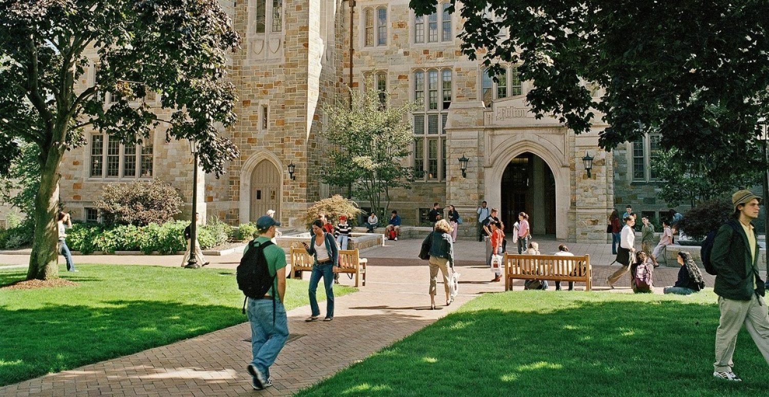 students walking in front of Fulton Hall