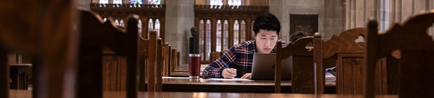A student studies in BC's Bapst Library.
