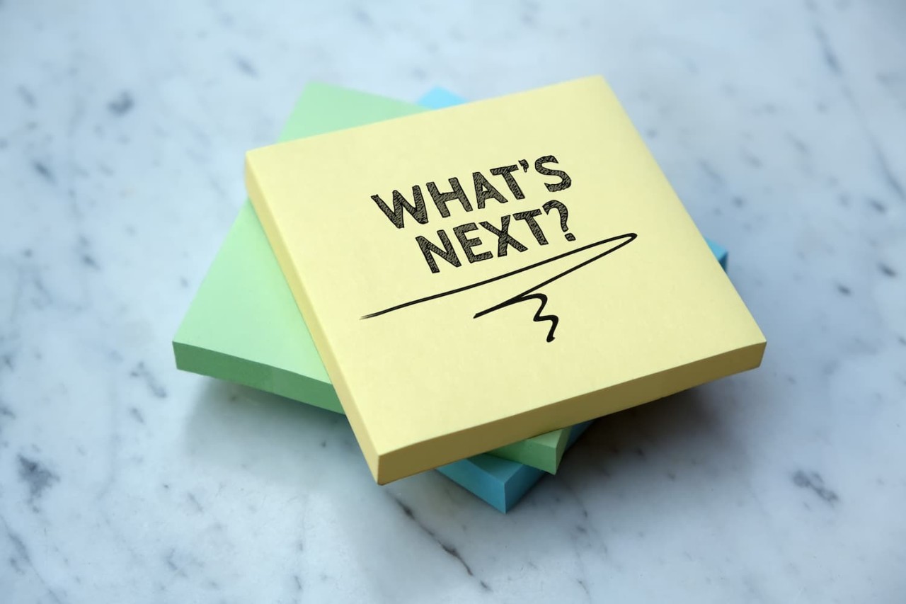 A photo of a post-it note that says "What's next?"