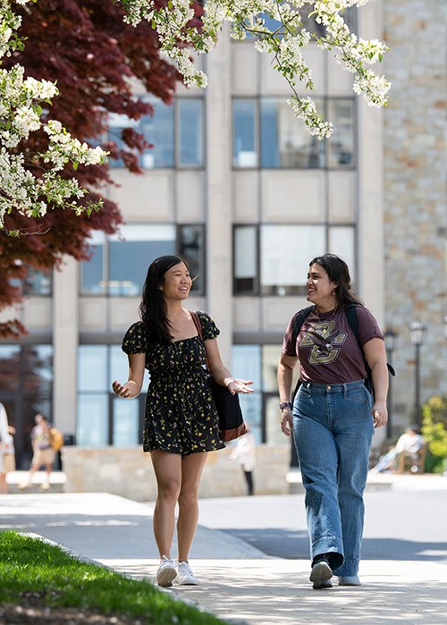 Taylor Goodman-Leong walks around campus with a peer