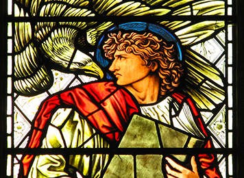 Photo of St. John and eagle in stained glass