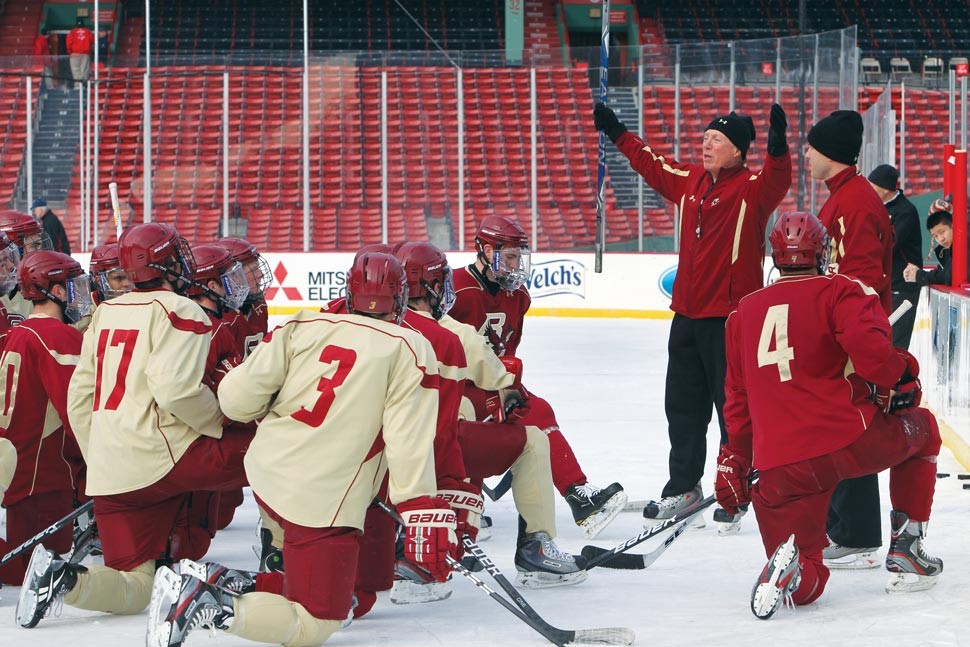 York coaching a practice on the ice at Fenway Park