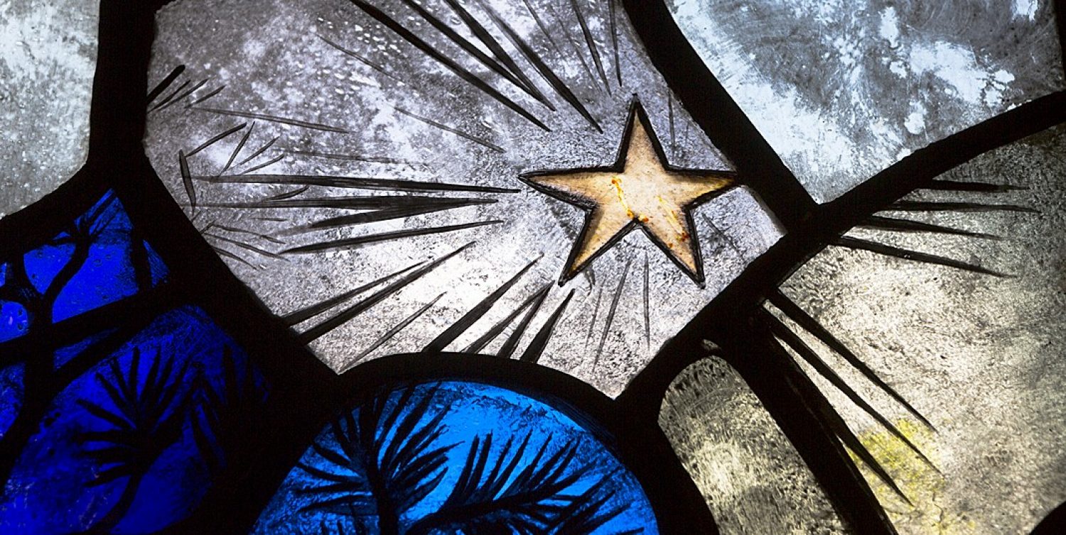 Star detail from the Epic Poetry stained glass window in the Thompson Room of Burns Library.