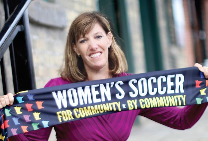 Andrea Yoch ’89 photographed holding soccer scarf