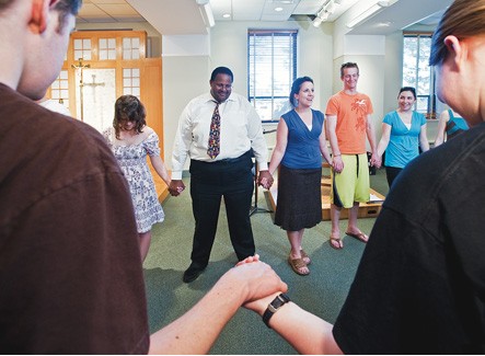 People holding hands in prayer