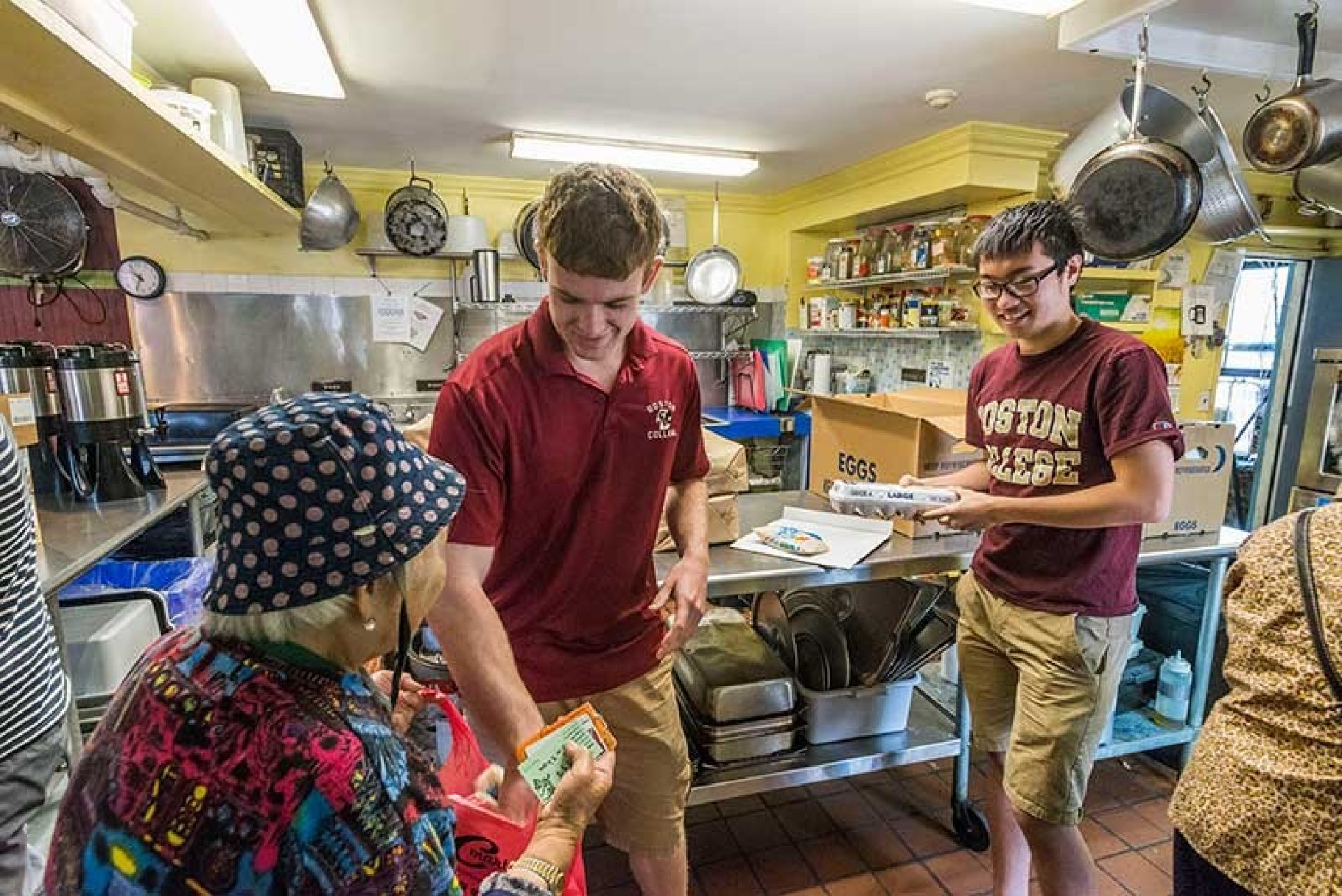 Students serving food in a soup kitchen