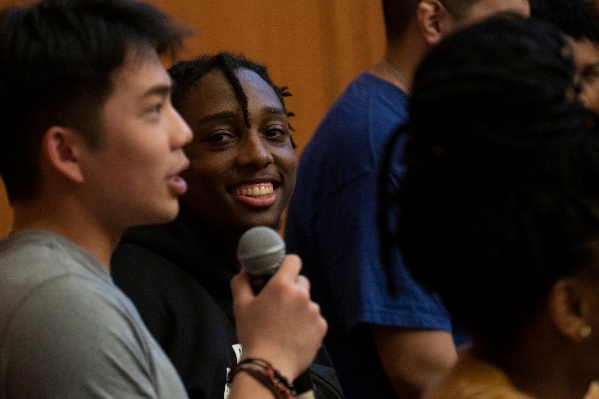 students speaking on a panel