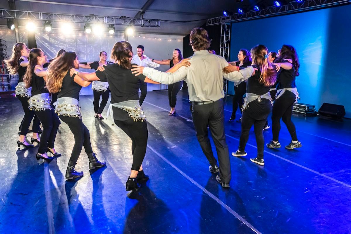 Students dancing in a circle