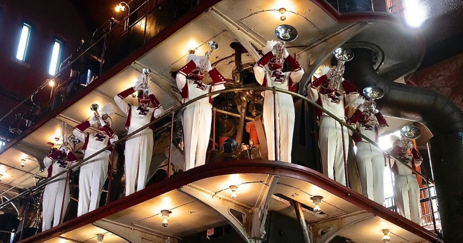 Marching Band musicians standing on a catwalk