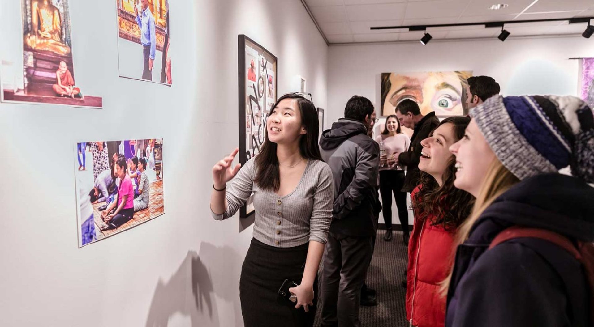 A group of people looking at art