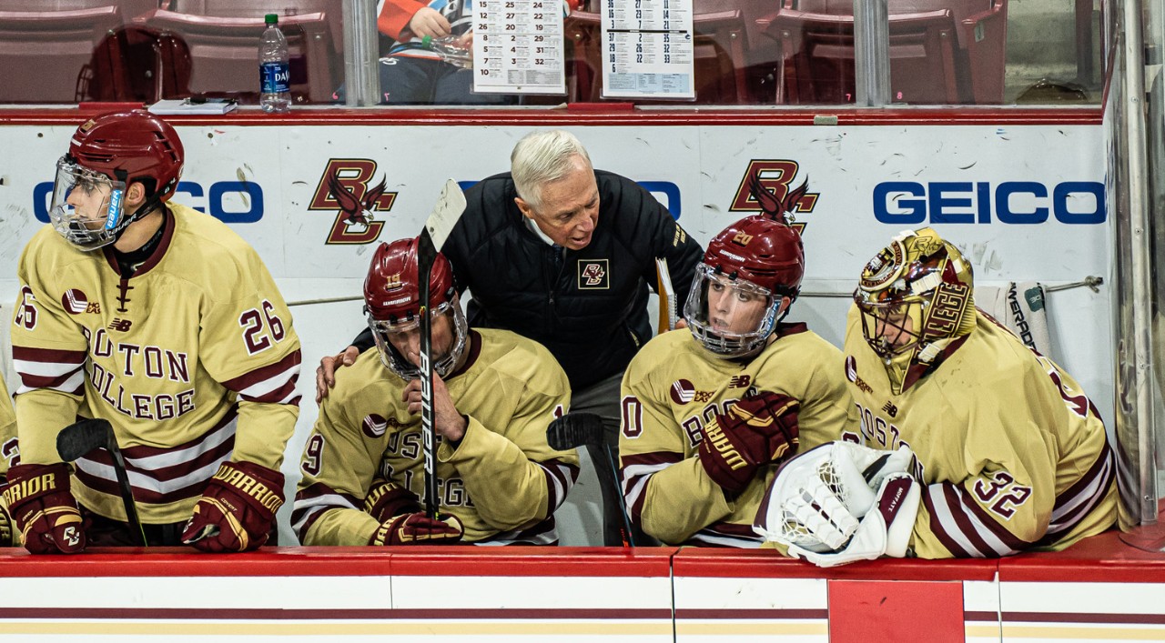 Jerry York with hockey players