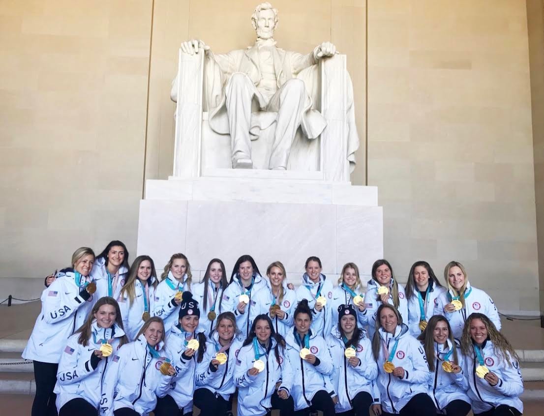 The women's hockey team at the Abraham Lincoln memorial