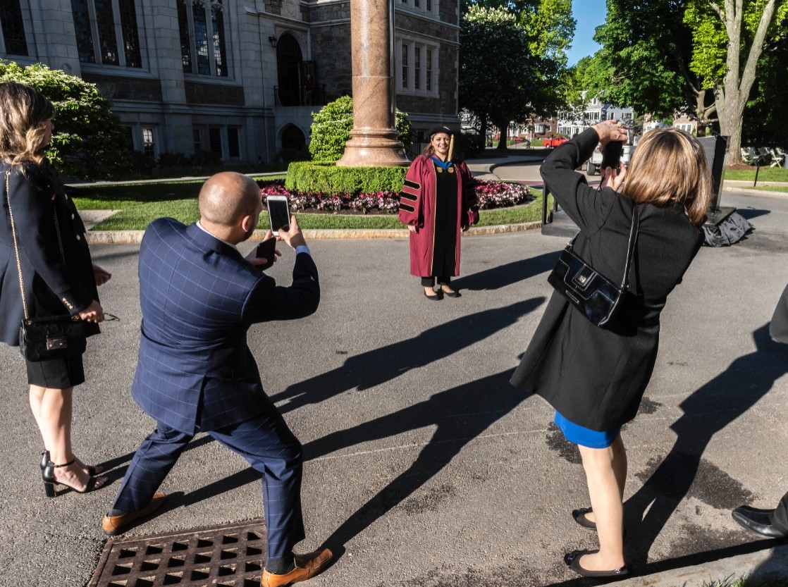 Family taking photos of a graduate