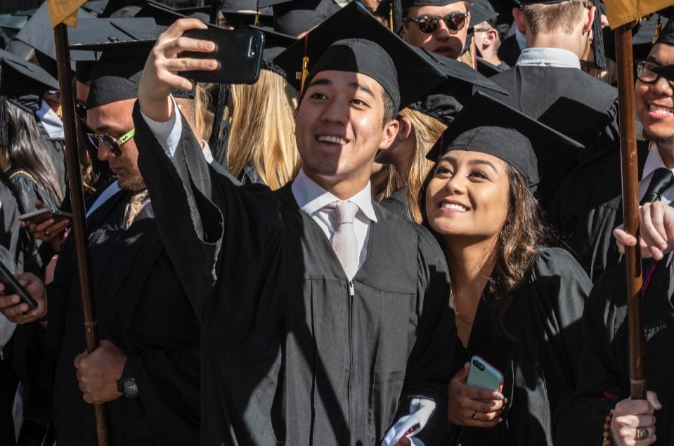 Graduates taking selfies