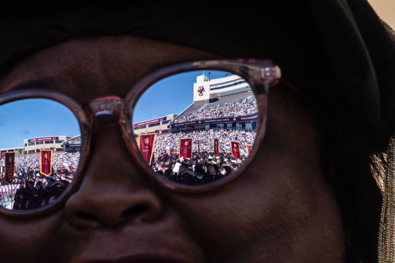 Crowd reflected in sunglasses