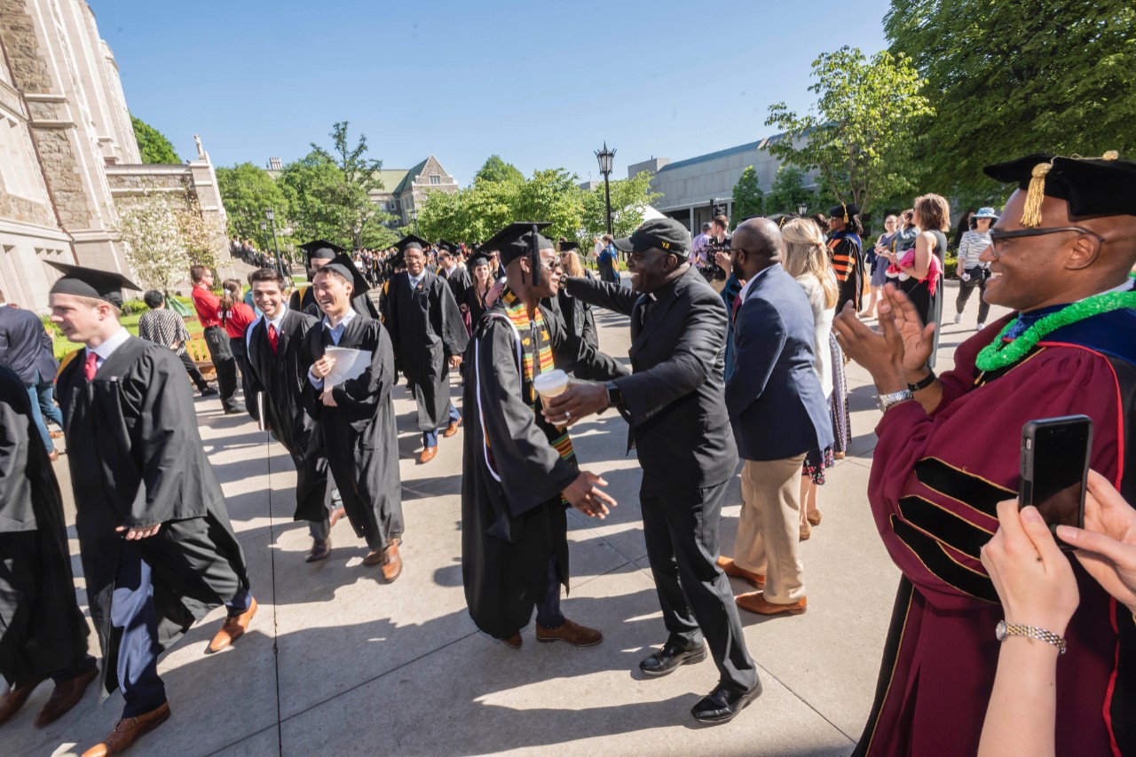 Graduates outside Gasson Hall