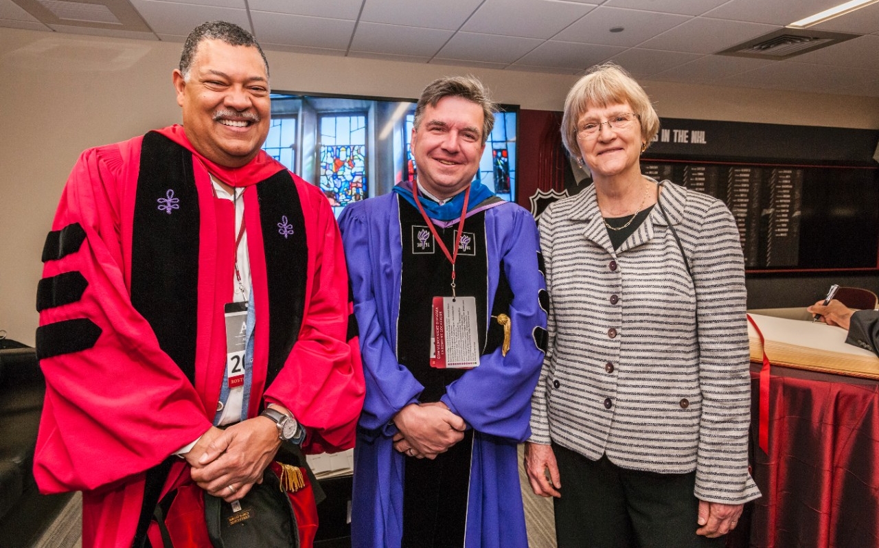 Boston College Law School Dean Vincent Rougeau and University Provost and Dean of Faculties David Quigley with outgoing Harvard University President Drew Gilpin Faust