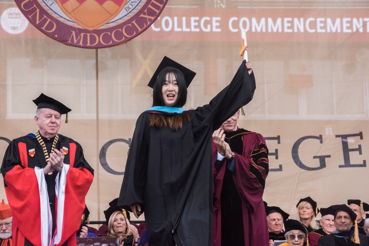 Student degree presentation at Boston College Commencement.