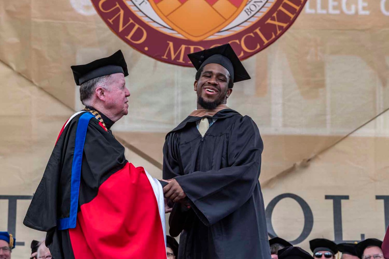 Graduate accepts diploma for the class