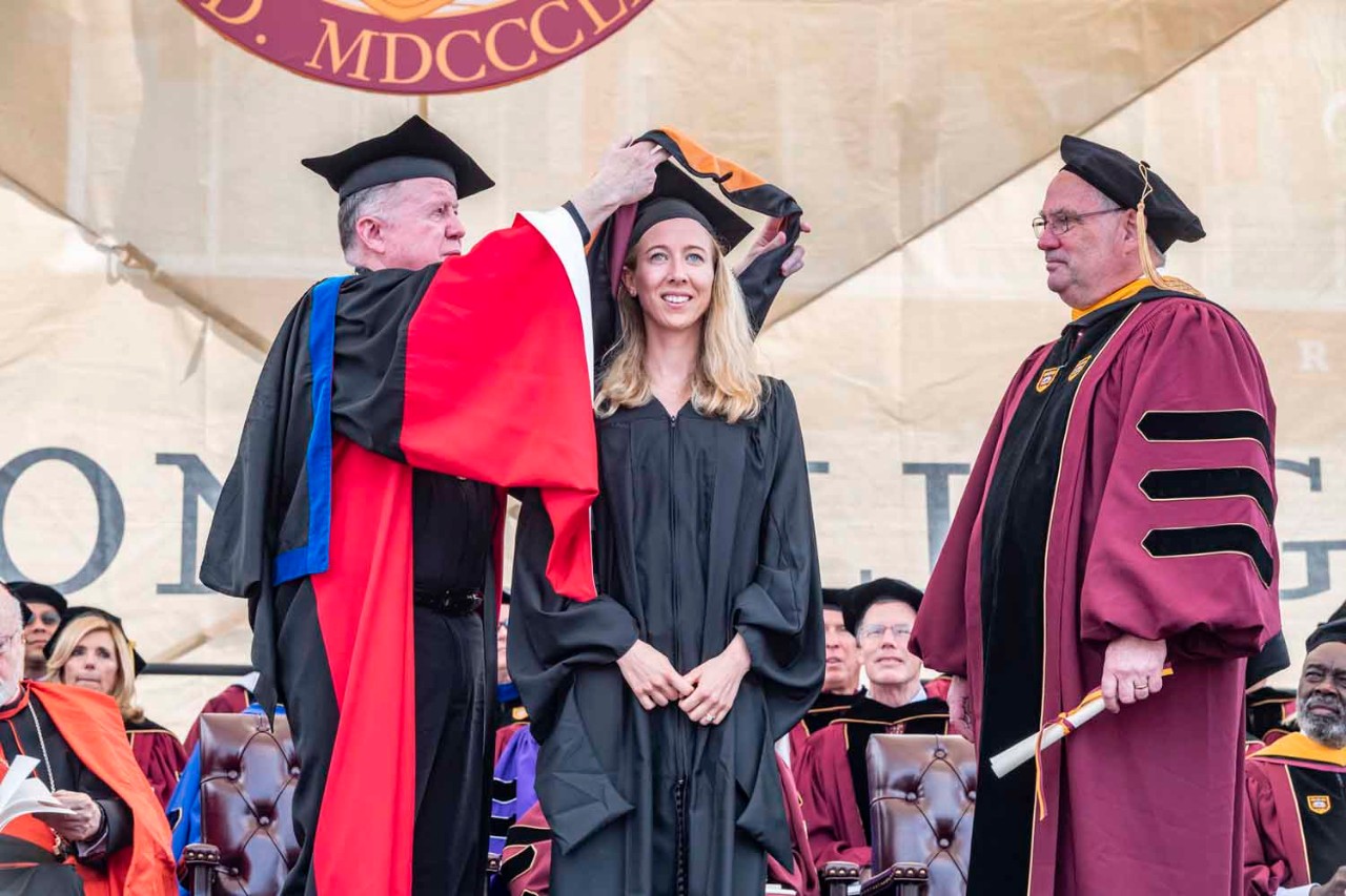 Graduate accepts diploma for the class