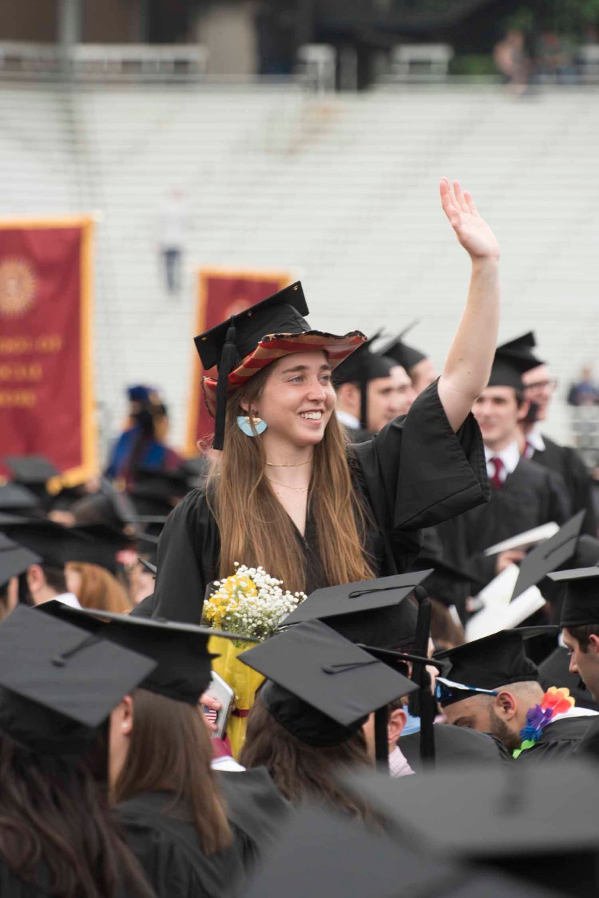Commencement 2019 PJ6 Graduate waving