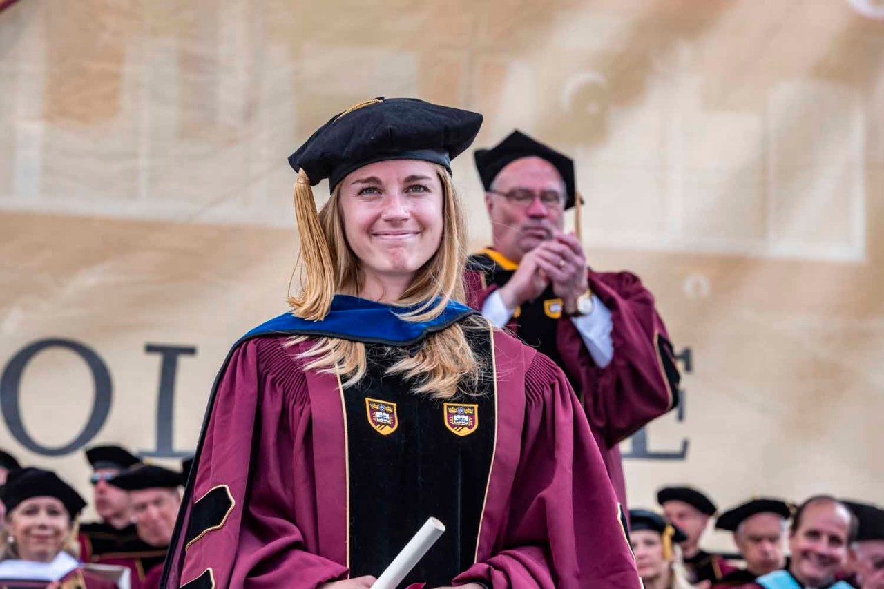 Graduate accepts diploma for the class