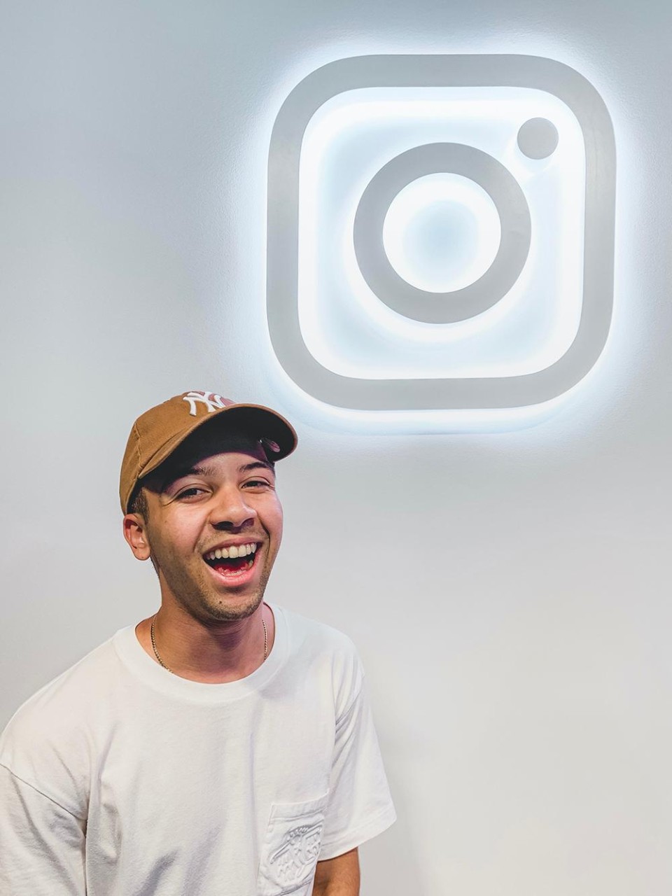 John Abreu in front of an Instagram logo