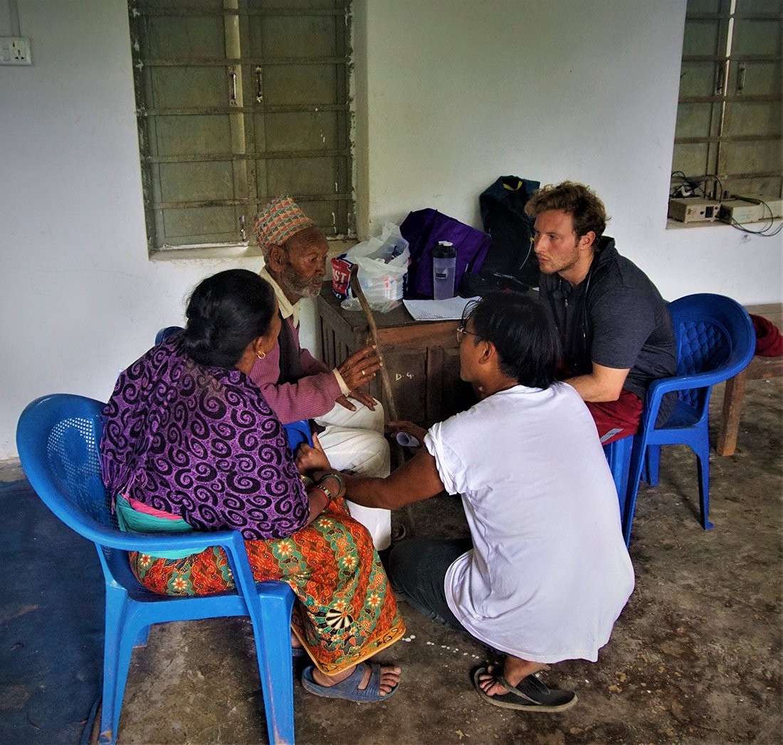 Rizzuto meeting with villagers in Nepal.