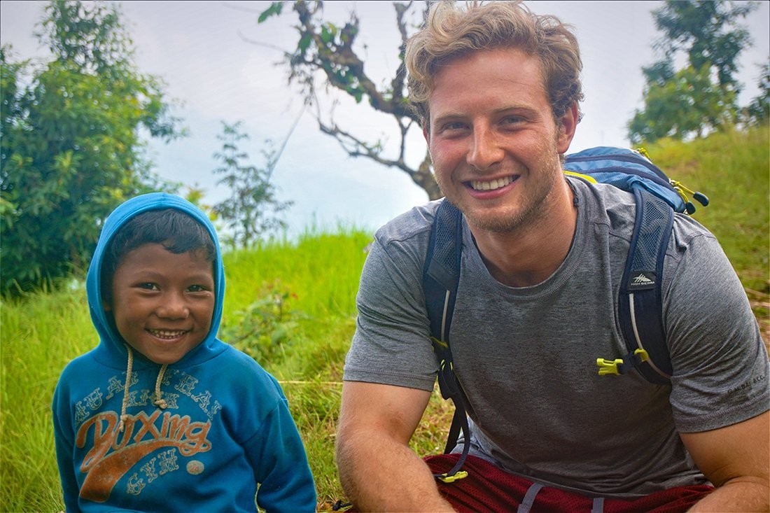 Rizzuto smiling next to a child