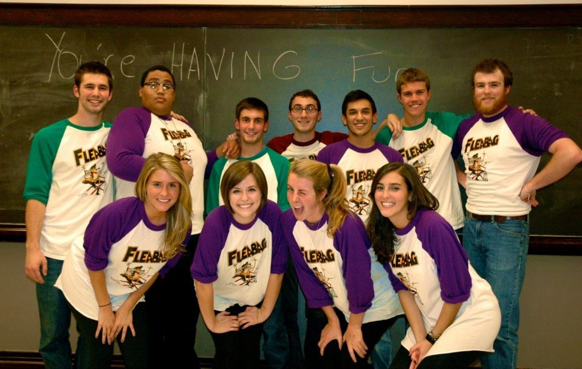 A group of improv actors posing for a photo