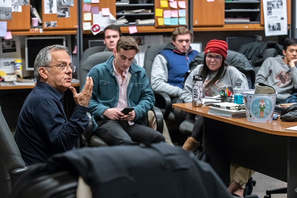 Mike Lupica visited with staff members of The Heights