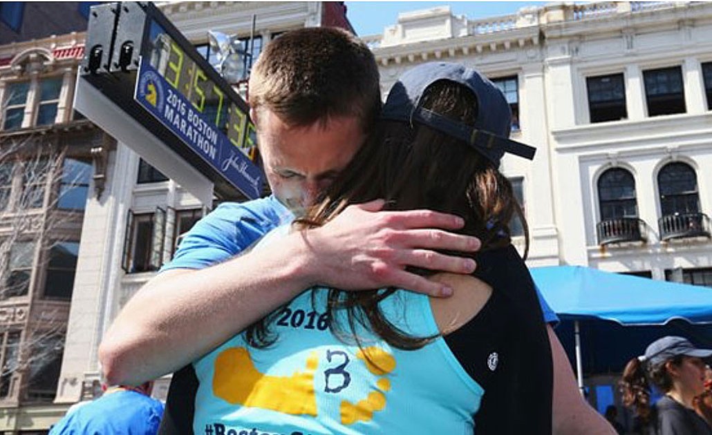 Patrick Downes and his wife, Jess Kensky, at the finish line of the 2016 Boston Marathon
