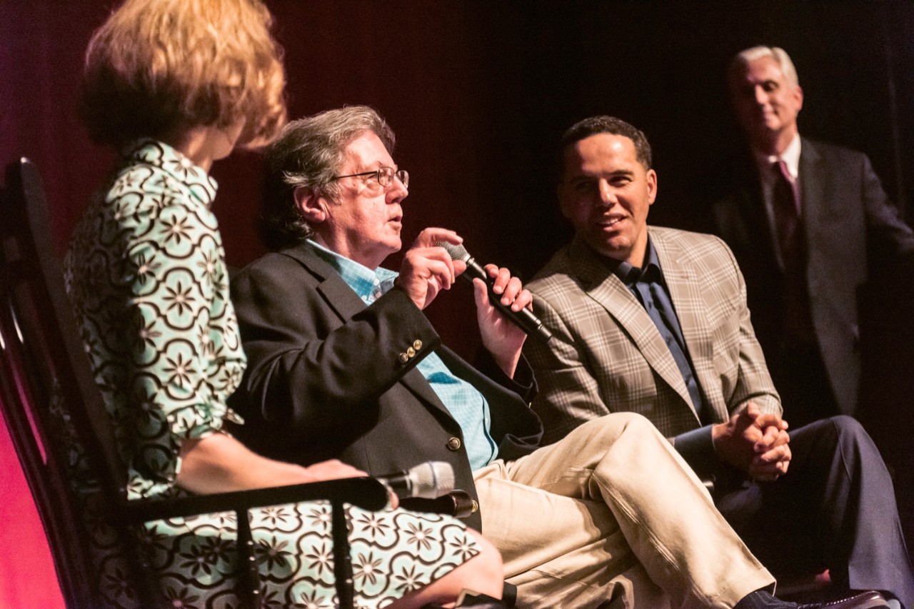 Steve Pemberton enjoys a point made by John Sykes, his former guardian and high school mentor, during a discussion following the screening. The panel included School of Social Work faculty member Tiziana Dearing and was moderated by University Communications AVP Jack Dunn.