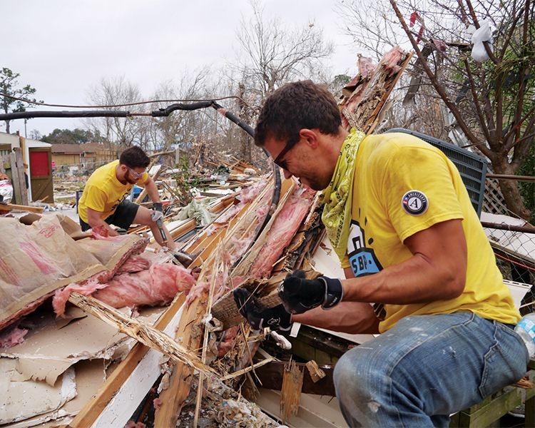 AmeriCorps members assist with the cleanup after the New Orleans East tornado in 2017.