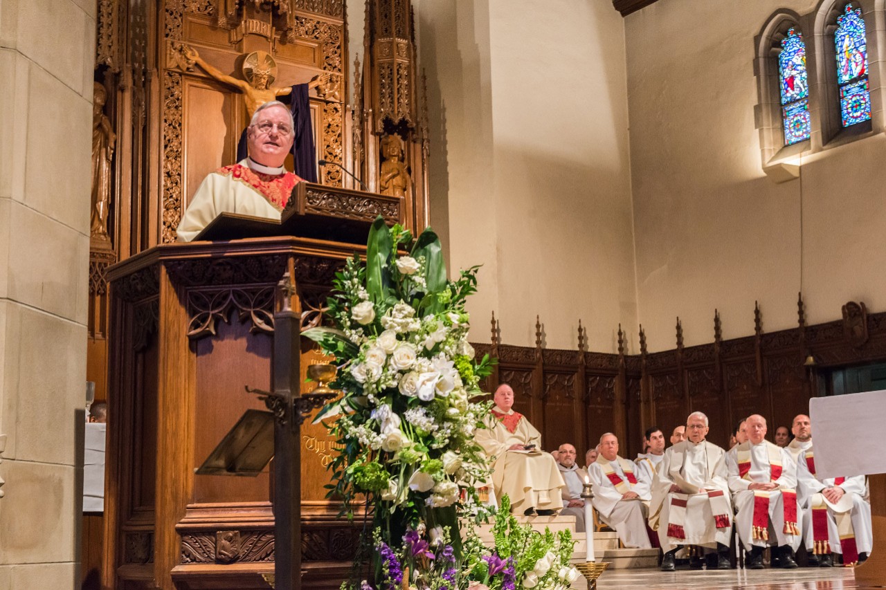 Rev. Joseph O'Keefe, S.J., delivers the eulogy for Fr. Monan