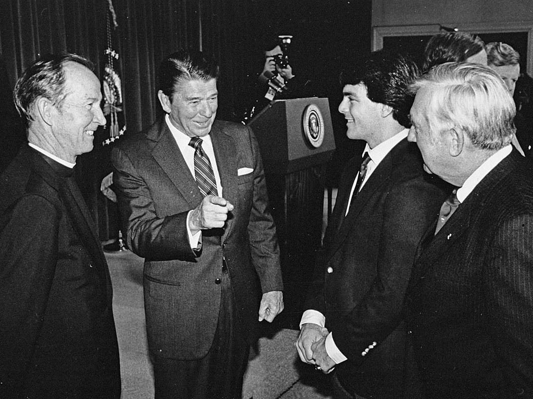 Fr. Monan, President Reagan, and Doug Flutie