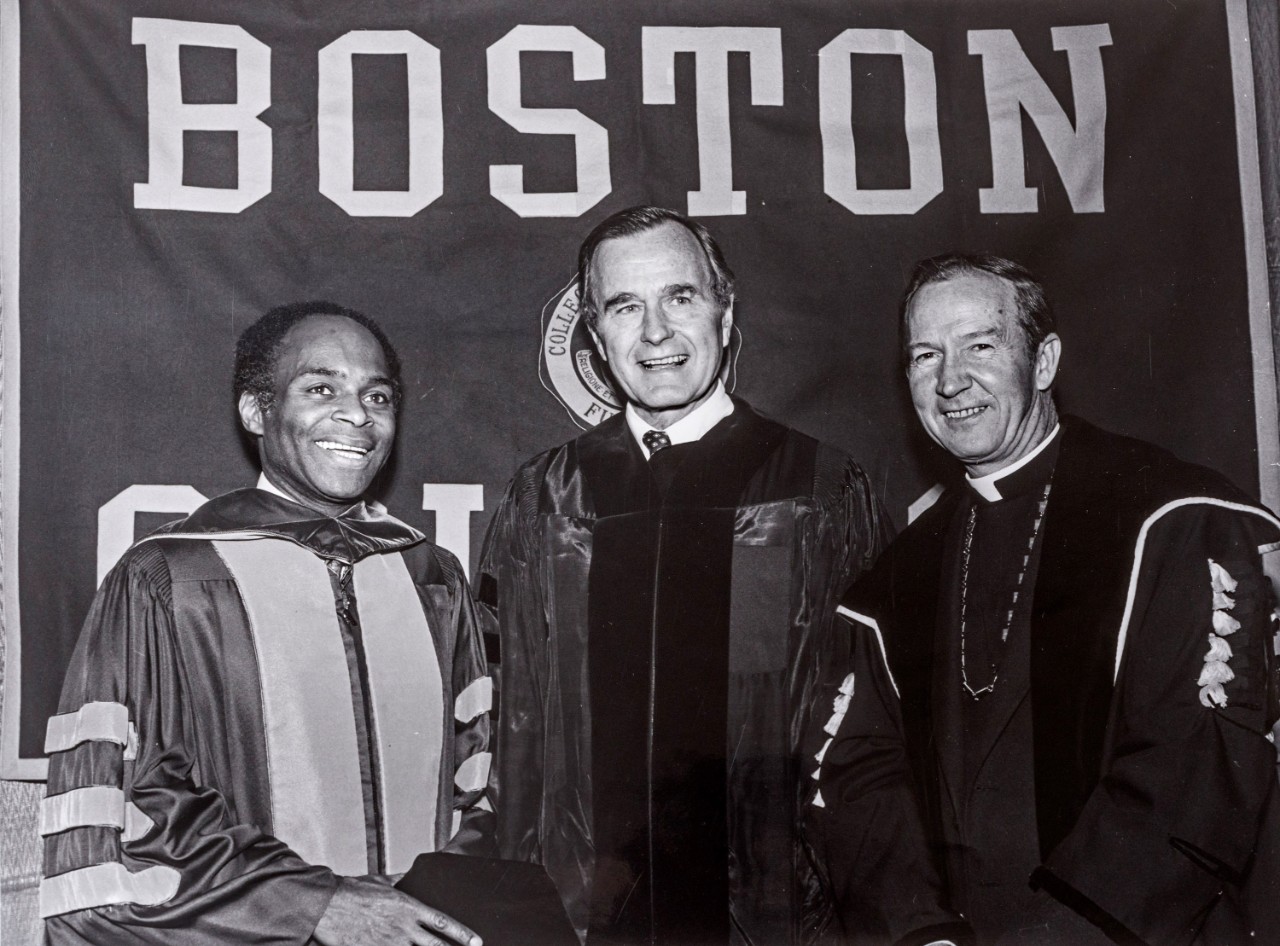 Fr. Monan, David Nelson, and George Bush Fr. Monan, David Nelson, and George Bush at Commencement 1982