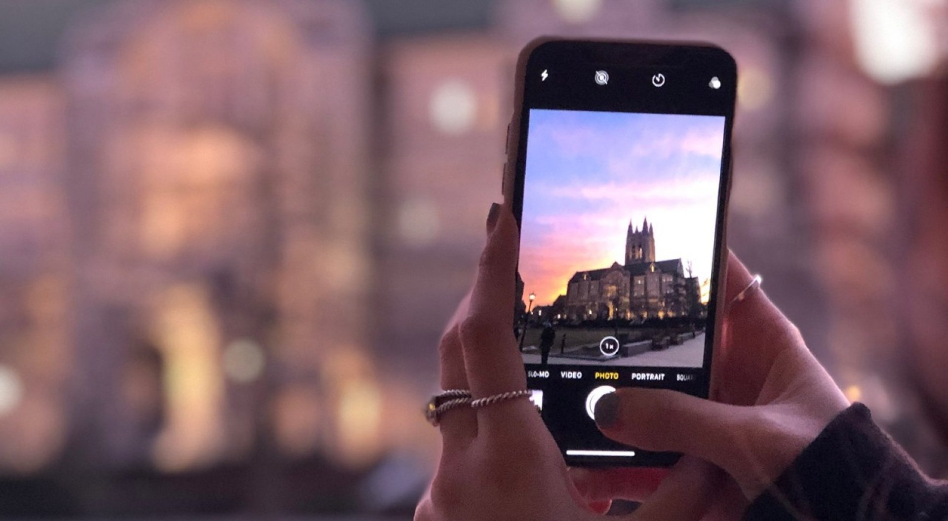 A hand holding a smartphone