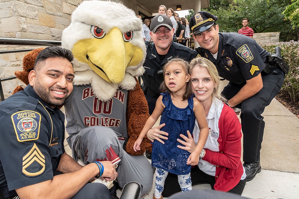 BCPD officers with a Campus School student, parent, and the BC mascot