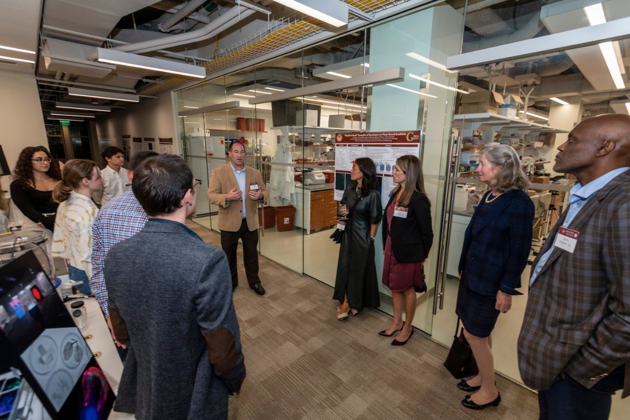 Glenn Gaudette talks to guests at 245 Beacon Street opening