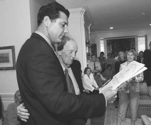 John McManama '37, MD, receiving a citation from Massachusetts Rep. Peter Koutoujian at a 2006 Boston College reception honoring Dr. McManama – who had recently turned 90 – for his years of work with University Health Services.