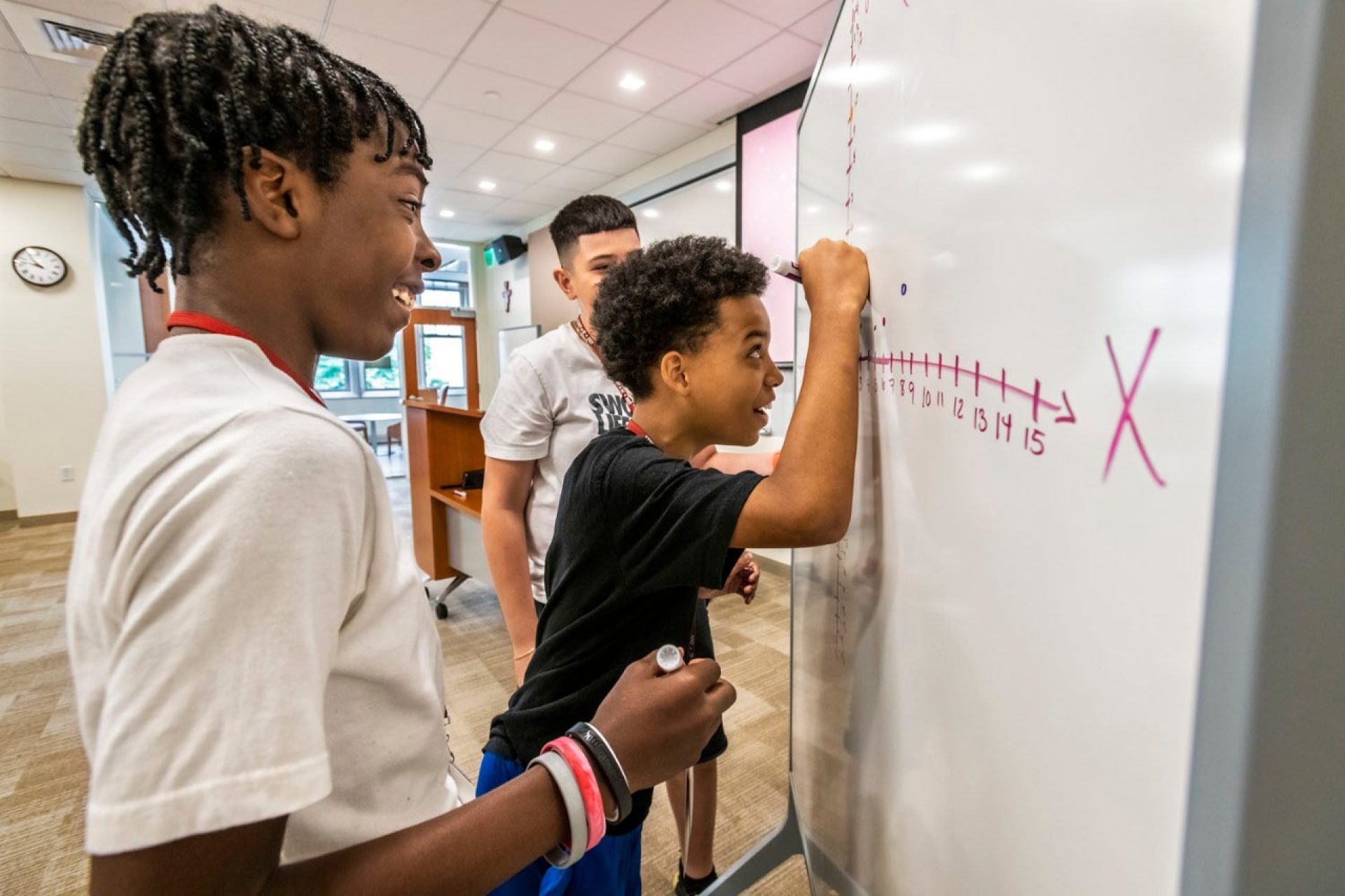 students looking at a laptop