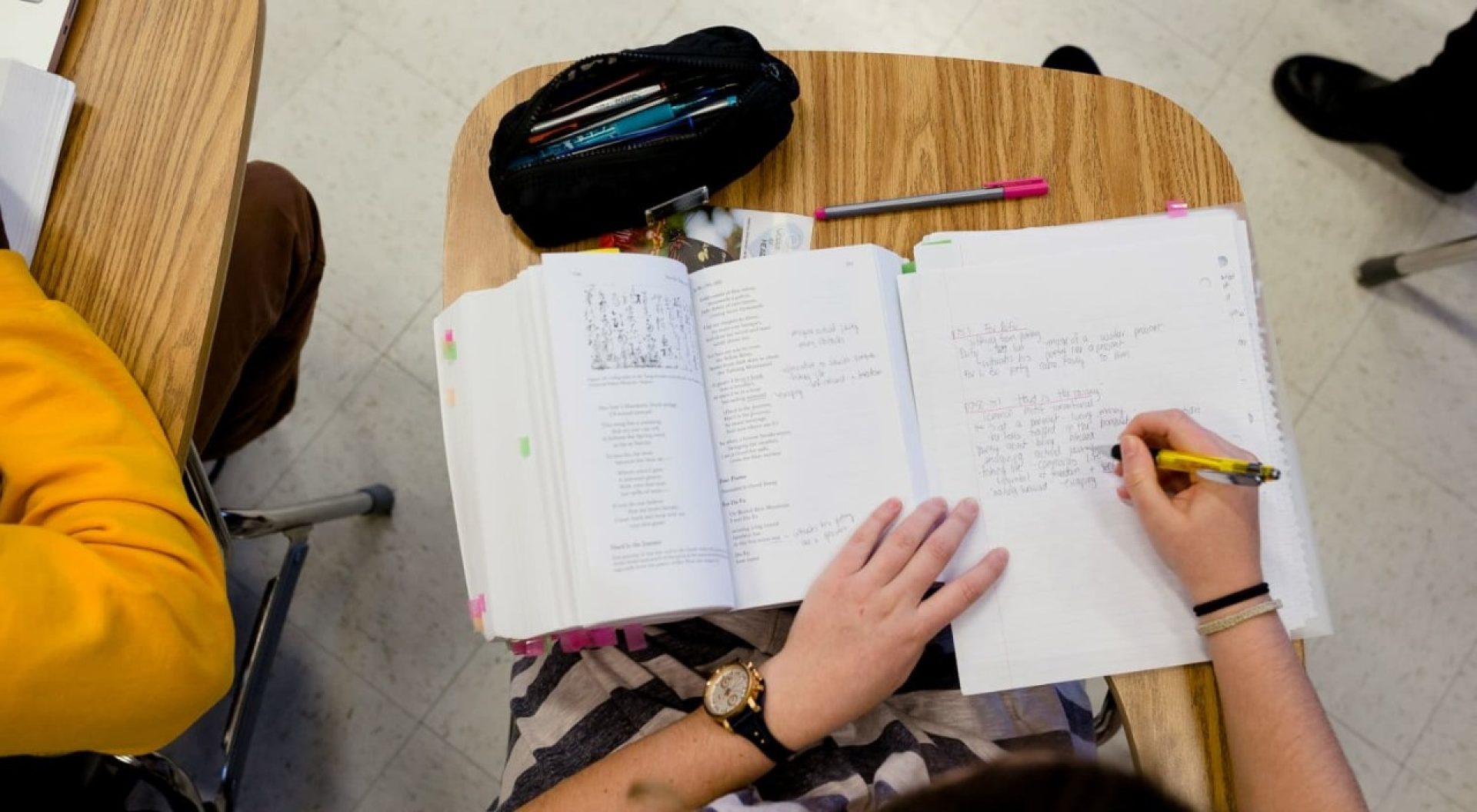 student taking notes