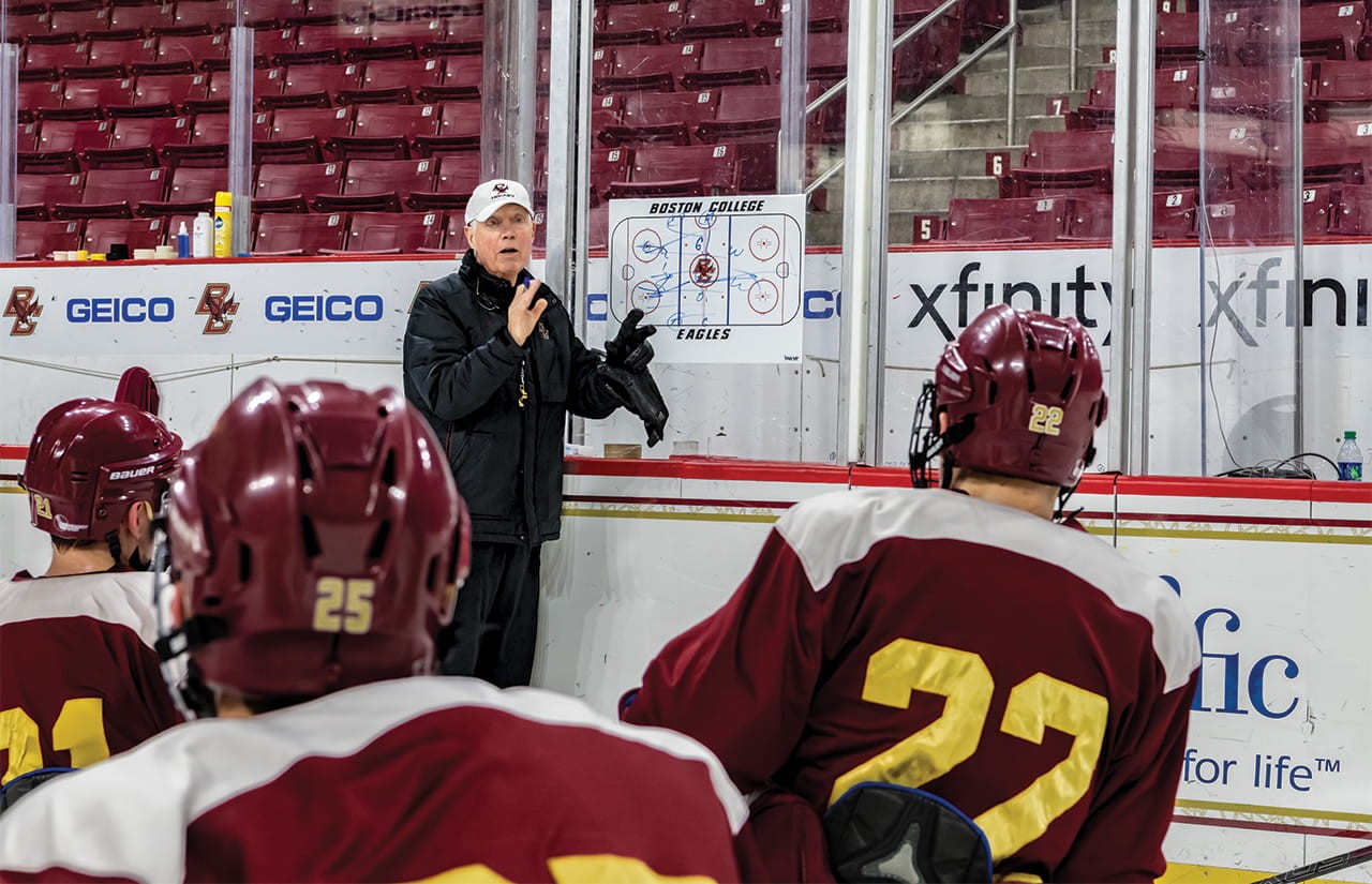 Hockey coach Jerry York instructs players