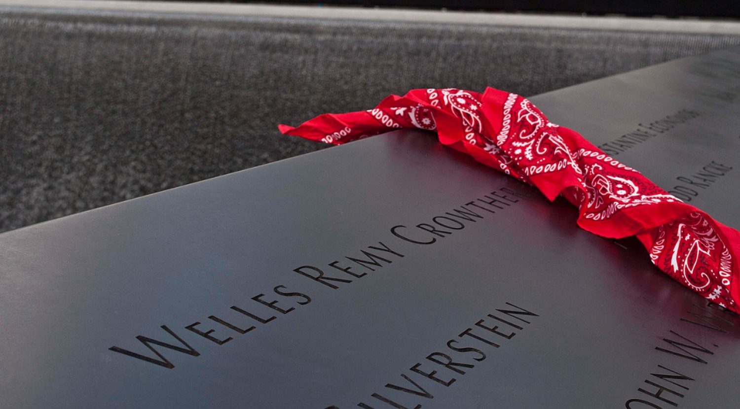 A red bandanna beside Welles Crowther's name on the 9-11 memorial 