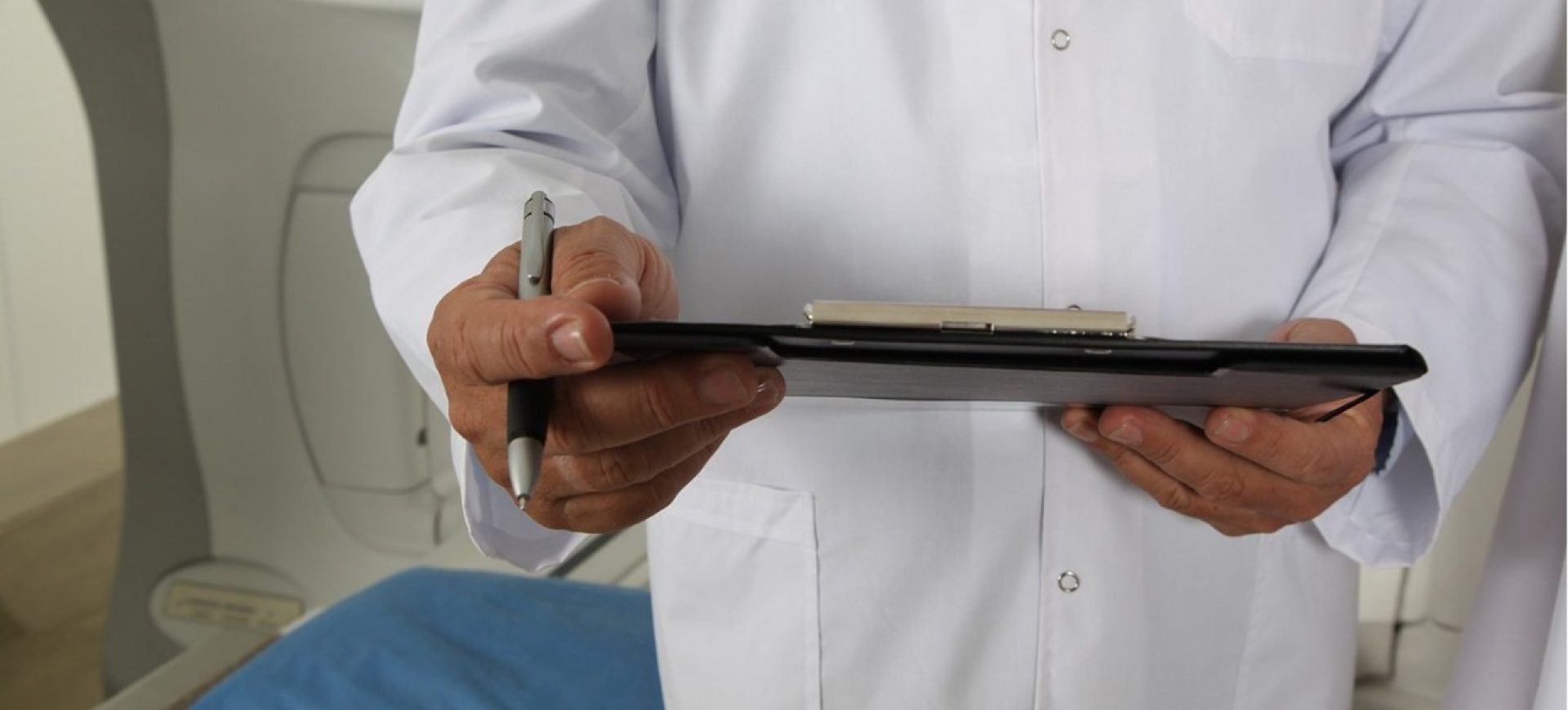 A doctor holding a clipboard