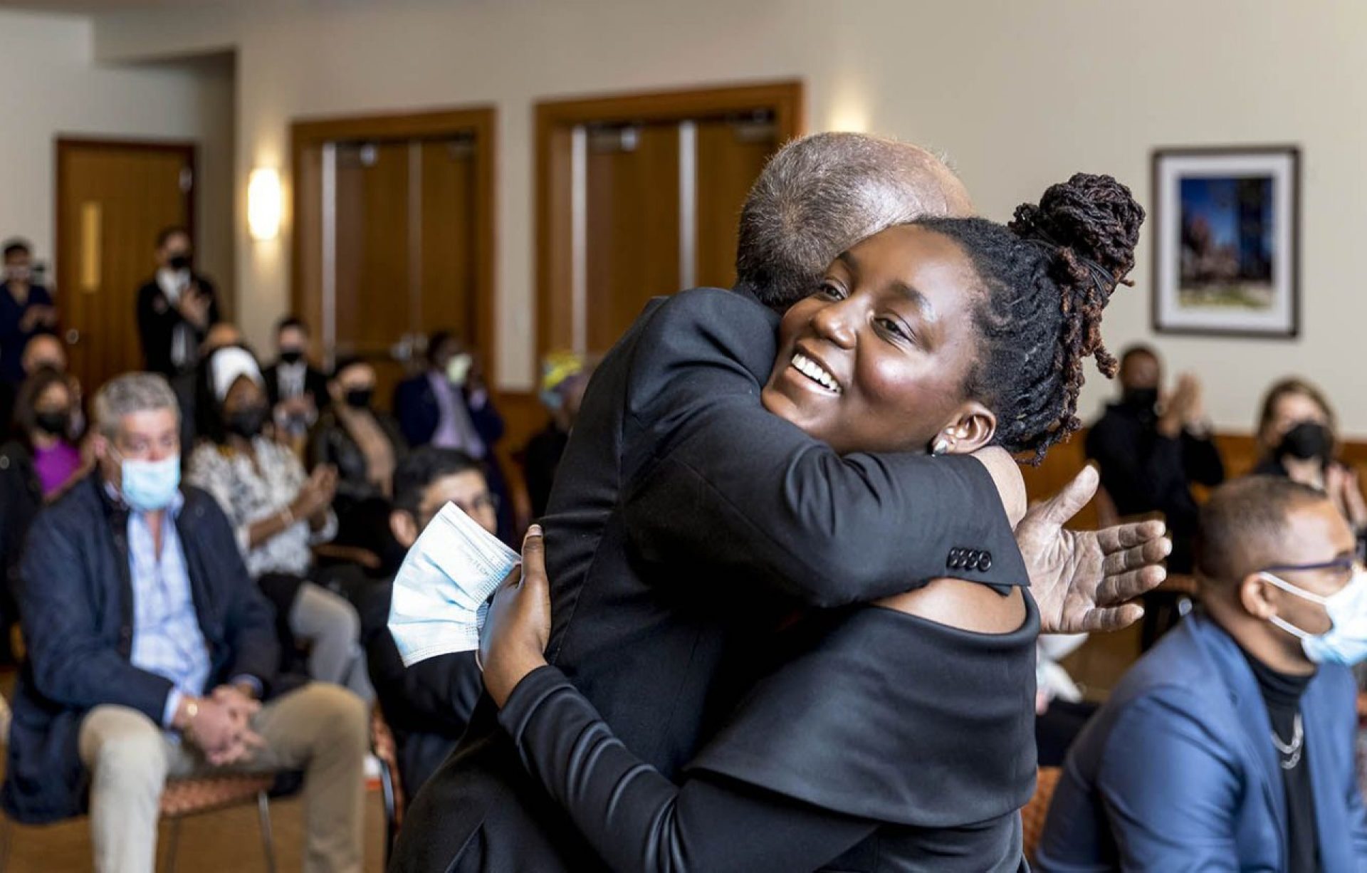 MLK Scholarship winner Kudzai Kapurura hugging someone