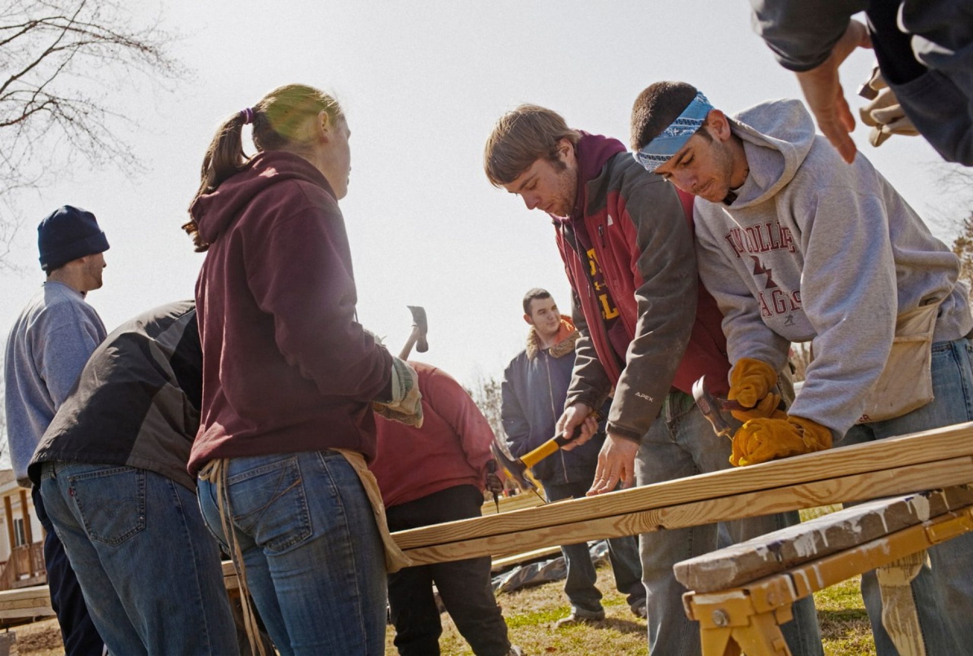 Students at work building a house